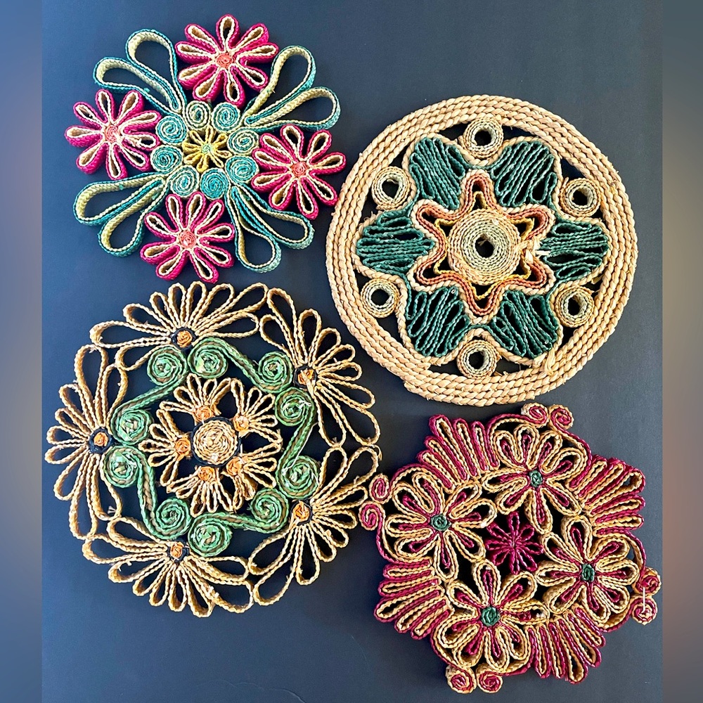 Vintage woven raffia trivets set of four. Beautiful designs for use or display